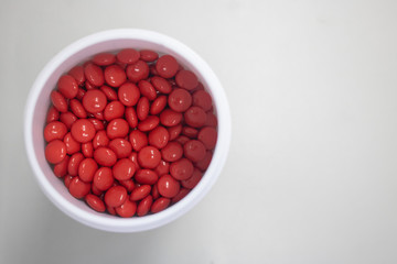 red medicine pills in can top view