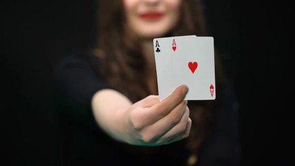 Female hand holding hearts and clubs aces, card pair, advantage, win chance