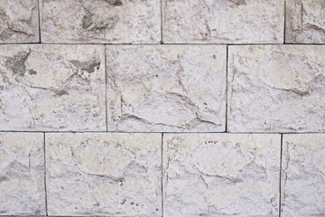 White tiled stone wall texture background.