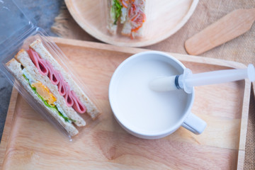 Homemade sandwich and fresh hot milk