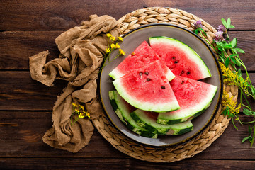 Watermelon. Fresh watermelon slices on plate on wooden rustic background