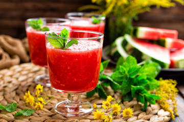 Watermelon smoothie. Watermelon drink, cocktail on wooden rustic background