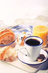 Croissant with Jam Espresso Coffee and a glass of Orange Juice Tradition of the Sunset Morning Baking Sweet Dessert Toned image