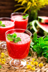 Watermelon smoothie. Watermelon drink, cocktail on wooden rustic background