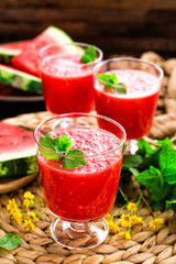 Watermelon smoothie. Watermelon drink, cocktail on wooden rustic background