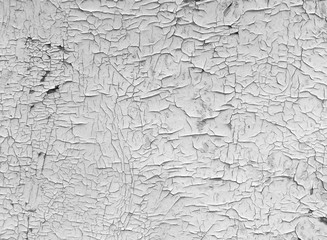 Old cracked paint texture on the wall. Close-up of vintage damaged surface