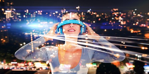 Composite image of smiling woman using virtual video glasses