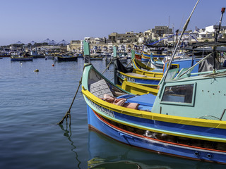 Maltese traditional fishing boat at the harbor of Marsaxlokk Malta