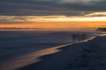 Fototapeta na wymiar Florida white sand beach sunset after storm long exposure