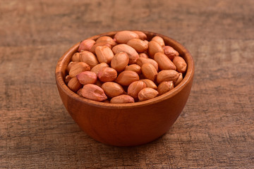 Hazelnuts bowl on wooden background
