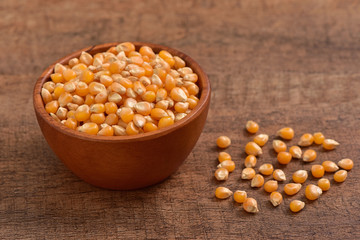 Popcorn seed on wooden background