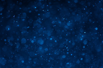 Abstract blue bokeh with black background