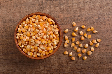 Popcorn seed on wooden background