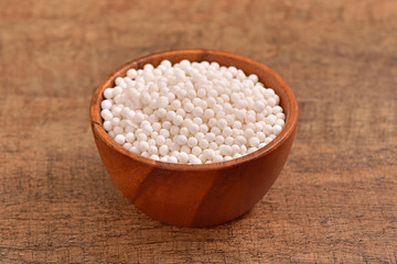 Tapioca pearls bowl on wooden background 