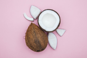 Tropical summer coconut on a pastel pink background.