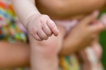 a small child's hand. child's hand