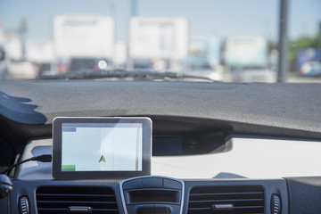 A car with a Navigator is located in the street Parking of the shopping center