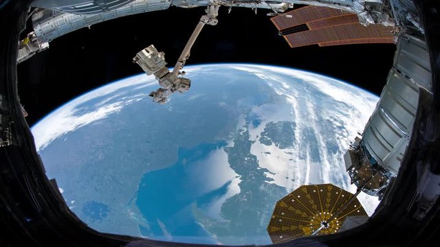 Earth as seen through window of International Space Station ISS . Elements of this image furnished by NASA.