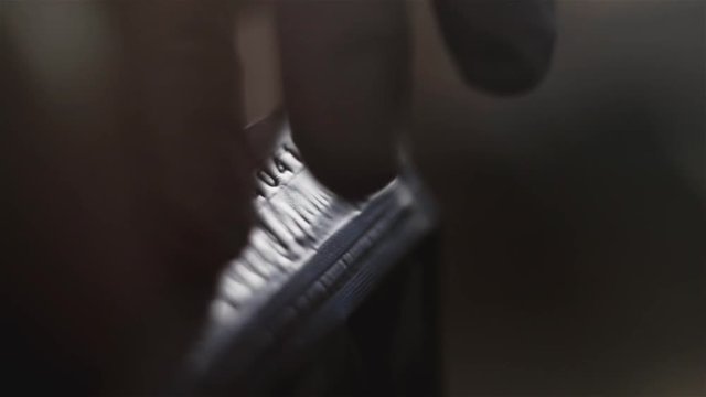 Hand of a man checking a secret number at night