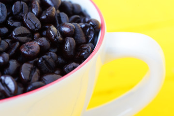 close up of coffee bean in coffee cup