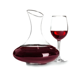 Elegant decanter and glass with red wine on white background