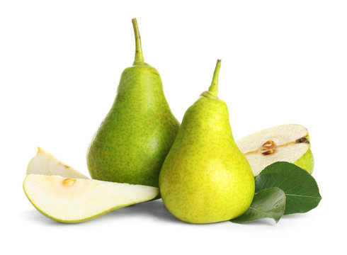 Whole and sliced pears on white background