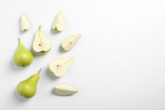 Ripe juicy pears on white background, top view