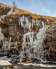 Fototapeta na wymiar Snow cliff at Gluggafoss waterfall in Iceland