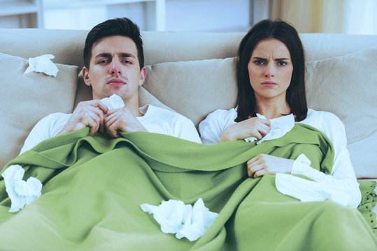 Young Couple Under Blanket.