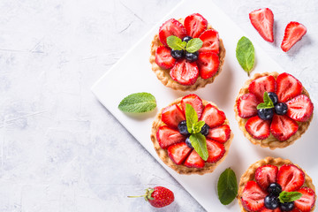 Strawberry tart on white. Summer dessert with berries