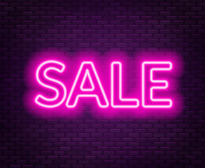 Sale neon lettering on brick wall background.