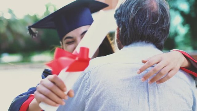 Graduated student hugging her father