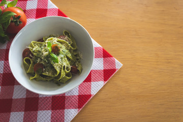 Pasta pesto in red fabric 