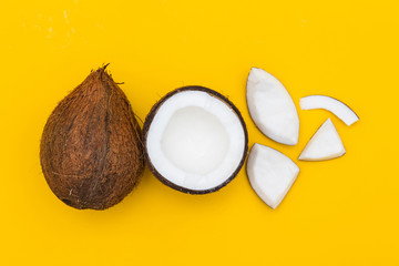 Tropical summer coconut on a yellow background.