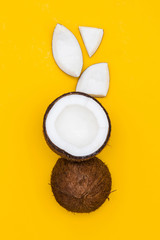 Tropical summer coconut on a yellow background.