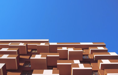 Bright outlook for business. Modern office block with sunny beautiful sky.