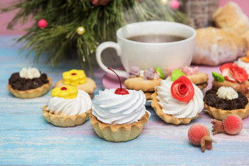 Obraz na płótnie Canvas Tasty cookie on a fir-tree background for happy new year holiday