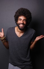 Afro man in front of a grey background