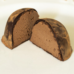 chocolate trufra cut in half brazilian bonbon on white background