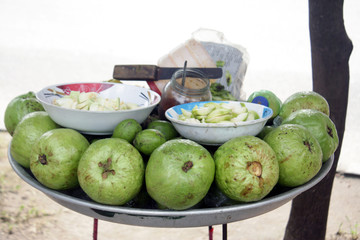Street-side Guava fruit shop. Guavas are common tropical fruits cultivated in many tropical and subtropical regions. Healthy organic fruit.