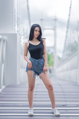 Obraz premium Portrait of beautiful asian woman black hair outdoor,Happy woman concept,Lifestyle of modern girl,Thailand people on the road in the forest