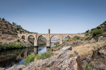 Fototapeta na wymiar Roman bridge over the Tagus River in the city of Alcantara (Caceres, Spain)