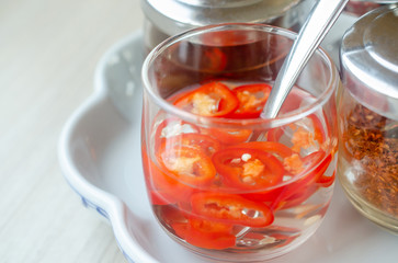 Red Chilli in Vinegar. Thai food seasoning. Sour and Spicy