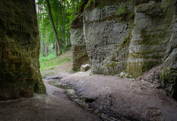 Obraz premium Old inscriptions in the cave called Little Hell. Gauja National Park, Latvia. Soft focus.