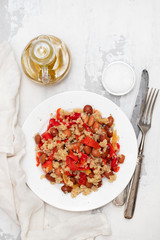 salad with quinoa on white plate on white background