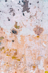 Remains of pinkish paint on the cement wall