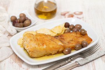 fried cod fish with olive oil on dish