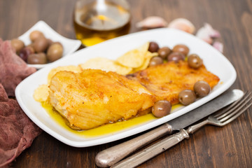 fried cod fish with olive oil on dish