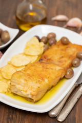fried cod fish with olive oil on dish