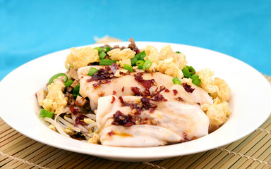 Steamed Rice Noodle roll or rice noodle paste with bean sprout with many topping and black sweet sauce.